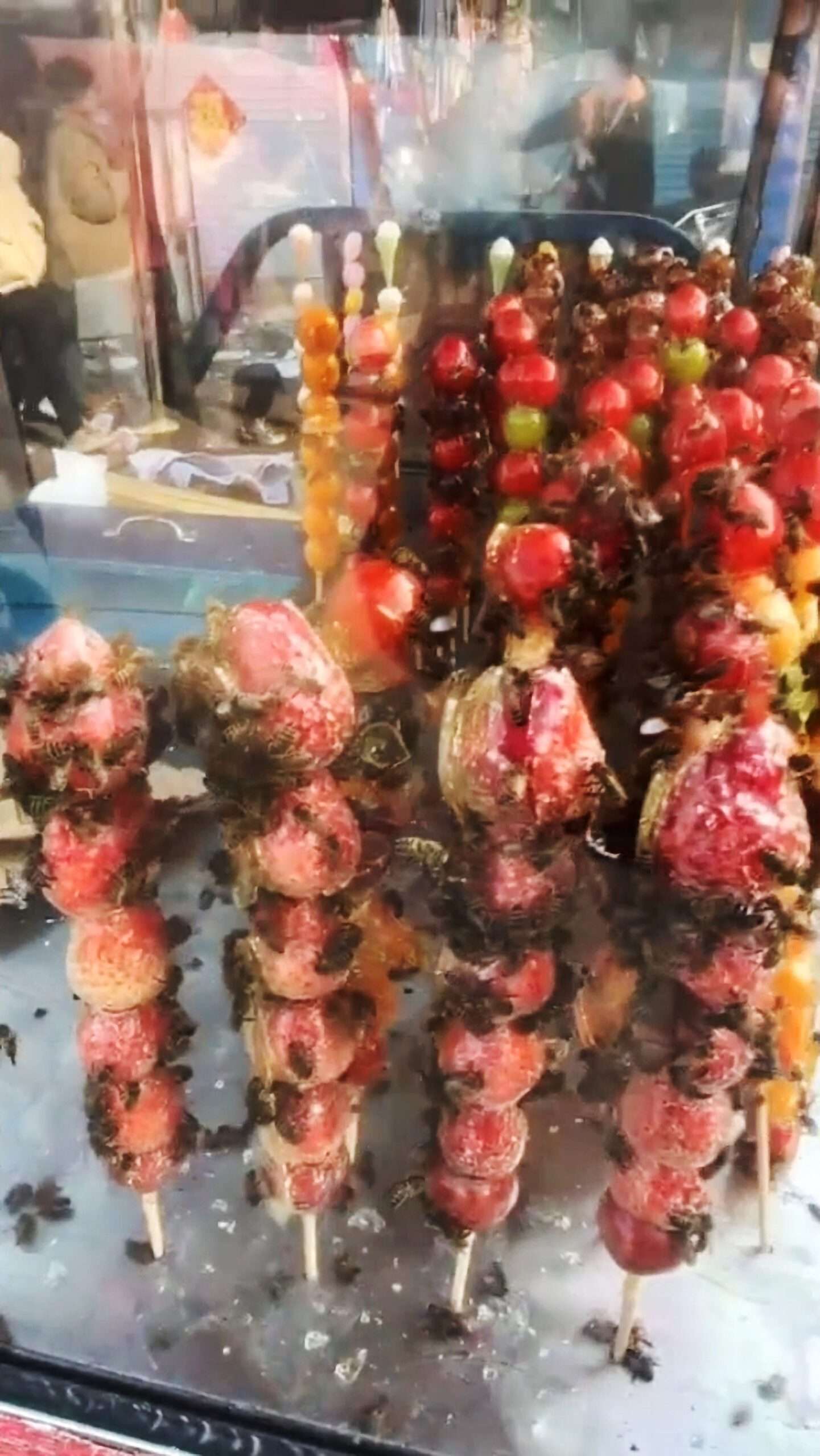Read more about the article Stall Owner Chased Away By Swarm Of Bees Attracted By Candied Fruit He Was Selling