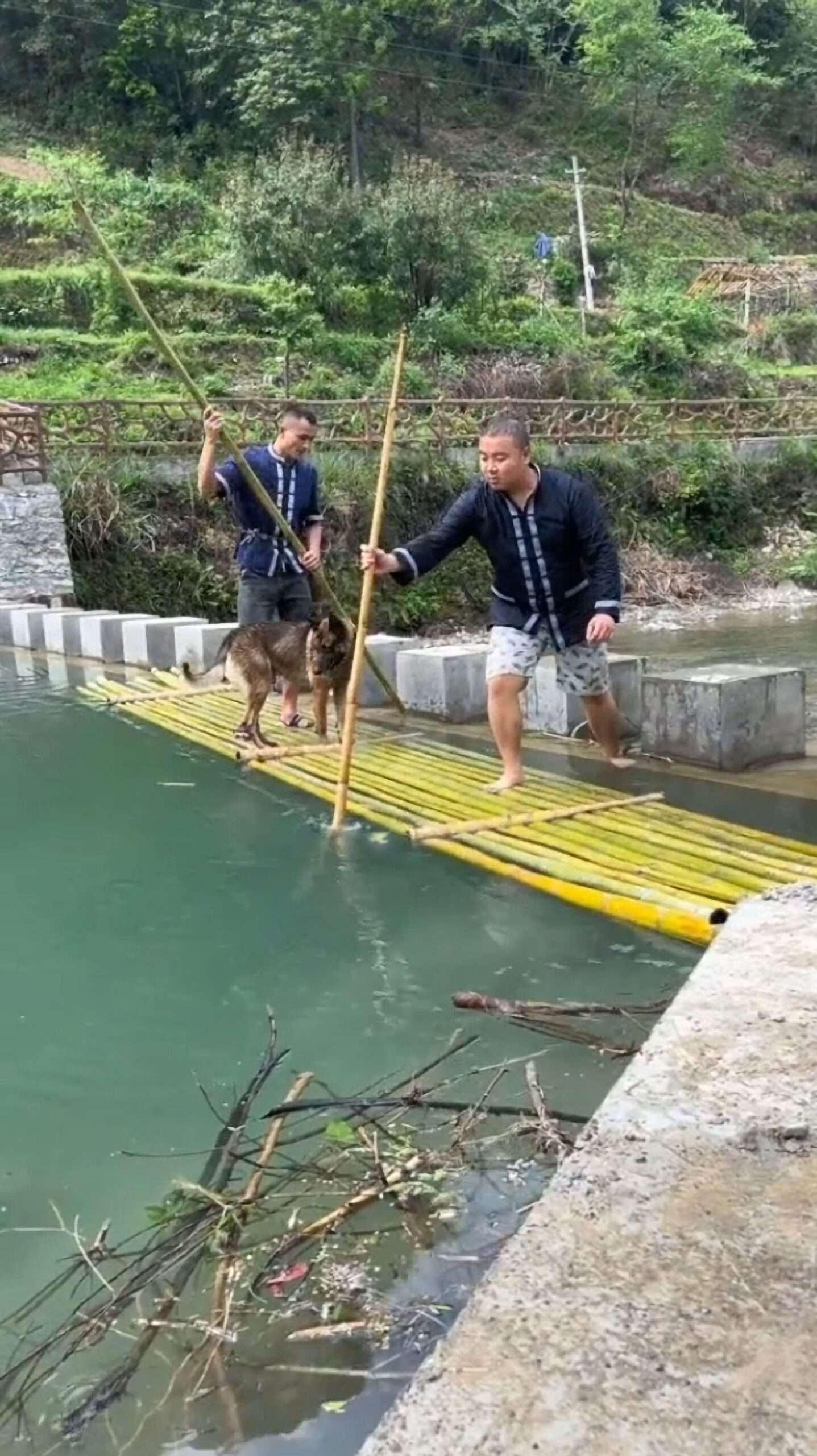 Read more about the article Two Men And Pet Dog Plunge Into River During Photoshoot Gone Wrong